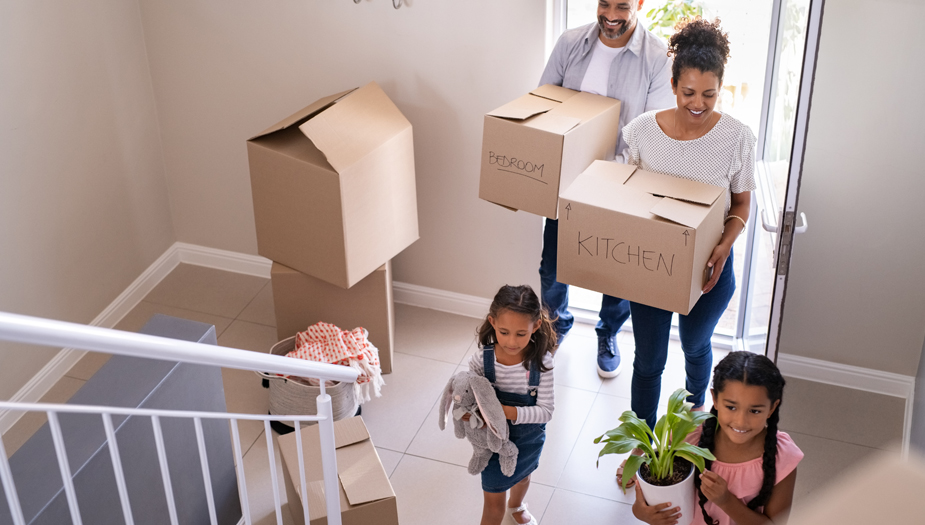 A family of four moving into the new house they were able to get because of their planned future